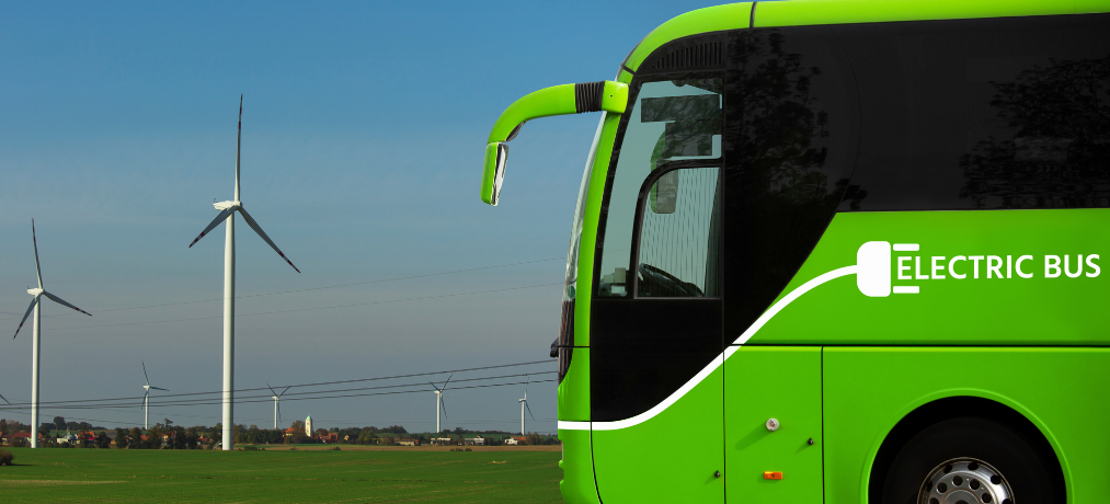 GREEN ELECTRIC BUS & WIND FARM TURBINES.png